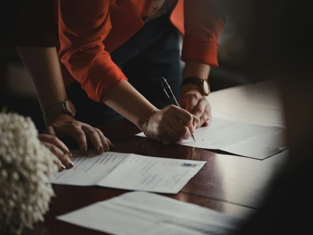 buyer and the seller signing the deed.